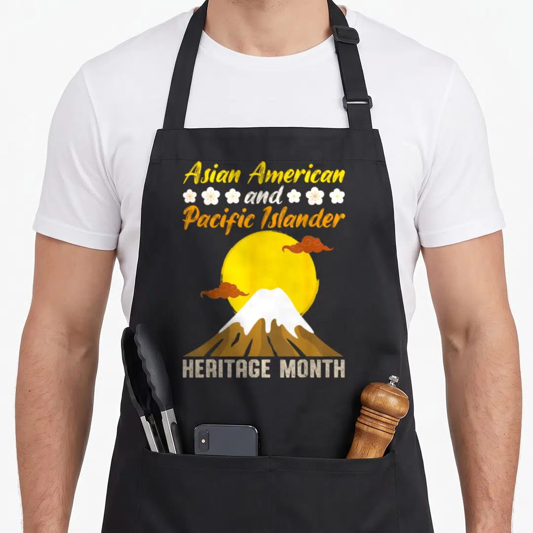 Pacific islander asian apron - Retro mountain and sun graphic with Asian American and Pacific Islander Heritage Month — shown on a black cotton canvas apron against a white background