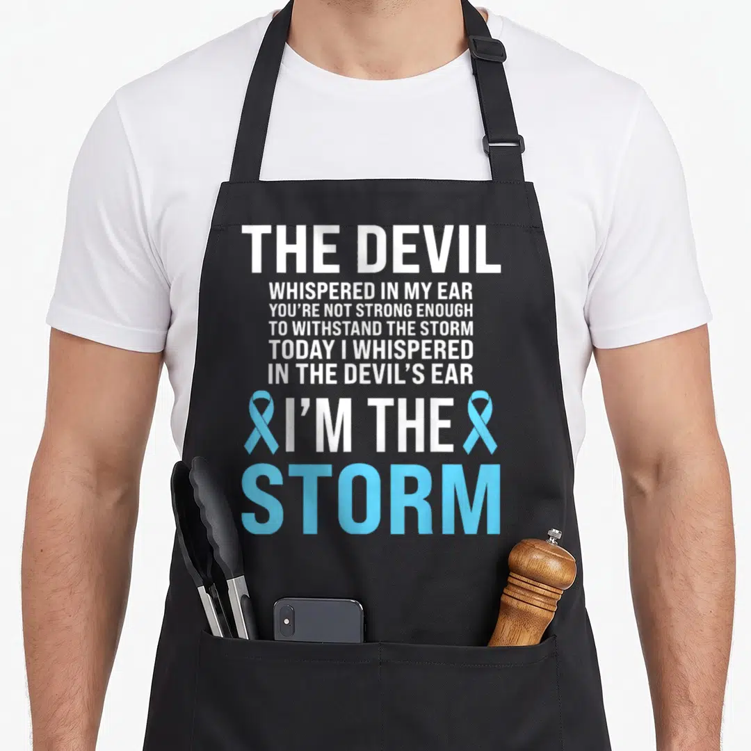 Awareness light ribbon apron - Stacked white text reading I'm The Storm flanked by two light blue awareness ribbons — shown on a black cotton canvas apron against a white background