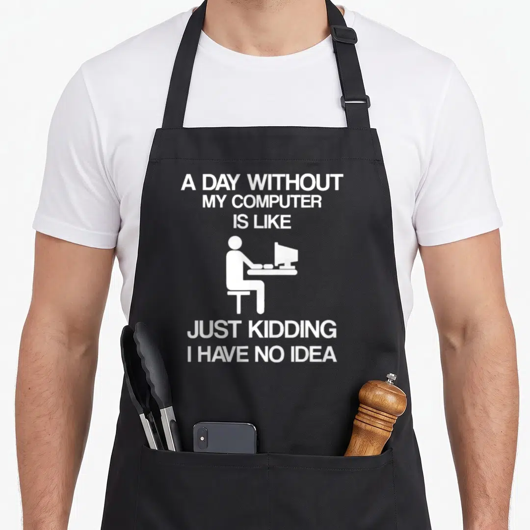 Computer table addict apron - White text and seated person silhouette on black background — shown on a black cotton canvas apron against a white background
