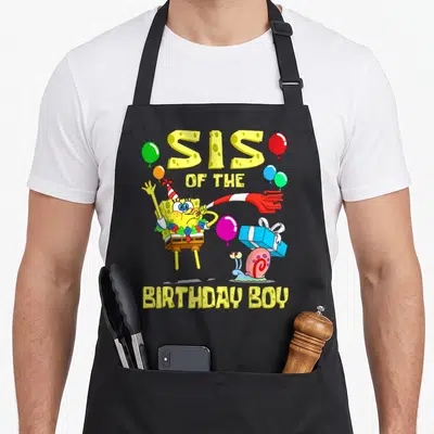 Sister theme birthday apron - SpongeBob SquarePants with party hat and horn surrounded by balloons and SIS — shown on a black cotton canvas apron against a white background