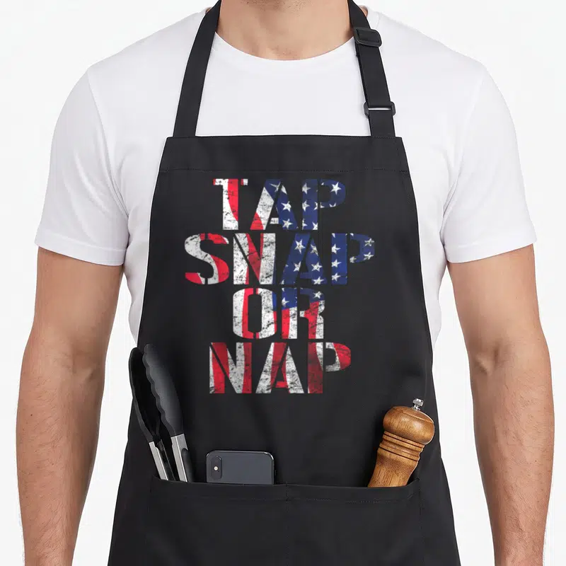 Bjj american flag apron - Distressed red white and blue typography reading TAP SNAP OR NAP stacked vertically — shown on a black cotton canvas apron against a white background