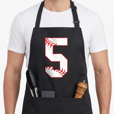 Fifth 5th birthday apron - White number 5 with red baseball stitching on black apron — shown on a black cotton canvas apron against a white background