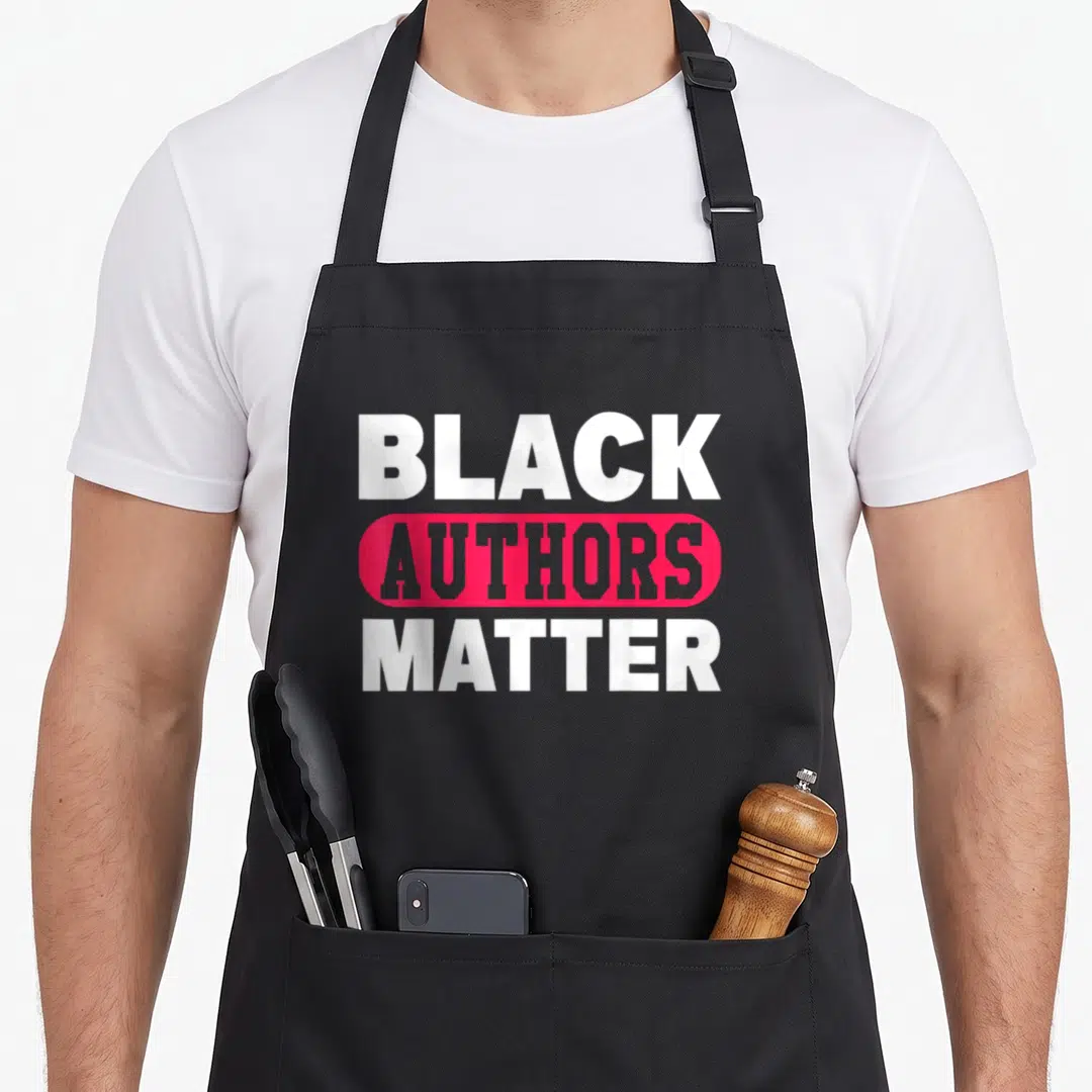 Matter author apron - Stacked text reading Black Authors Matter over a pink rounded rectangle — shown on a black cotton canvas apron against a white background