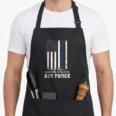 Veteran state air us aprons - Distressed white and blue USA flag with vertical VETERAN OF THE UNITED STATES AIR FORCE — shown on a black cotton canvas apron against a white background
