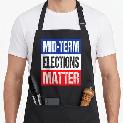 Vote midterms humor apron - Stacked MID-TERM ELECTIONS MATTER text on blue white and red horizontal bands — shown on a black cotton canvas apron against a white background