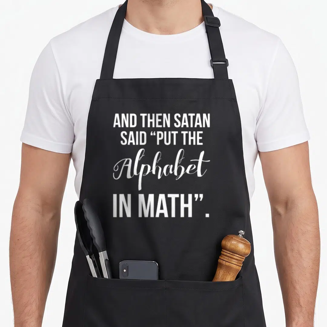 Alphabet math teacher apron - White four-line stacked text reading AND THEN SATAN SAID PUT THE Alphabet IN MATH — shown on a black cotton canvas apron against a white background