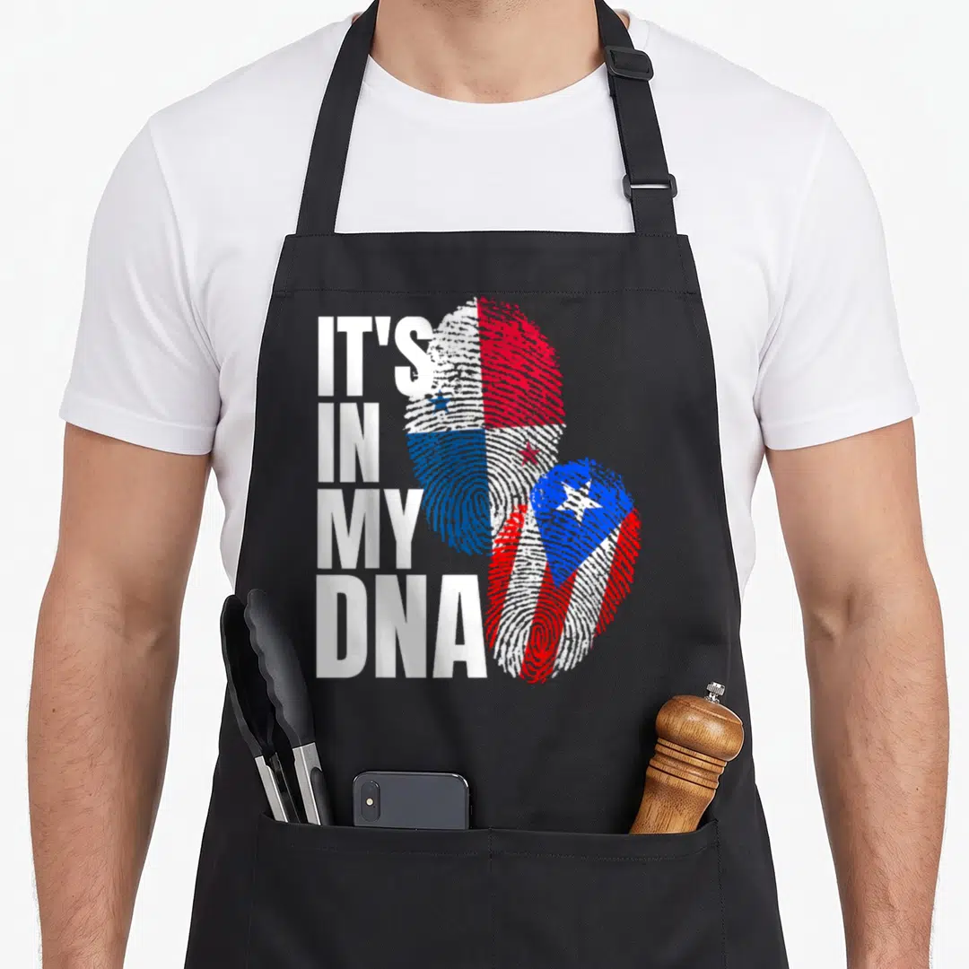 Panamanian puerto heritage aprons - IT'S IN MY DNA text beside two fingerprints filled with Panamanian and Puerto Rican — shown on a black cotton canvas apron against a white background