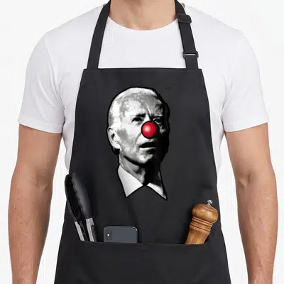 Biden clown aprons - Realistic man portrait with red clown nose in black white and red — shown on a black cotton canvas apron against a white background