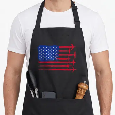 Aircraft chef and co aprons - Distressed USA flag with six red airplanes forming stripes in blue and white — shown on a black cotton canvas apron against a white background
