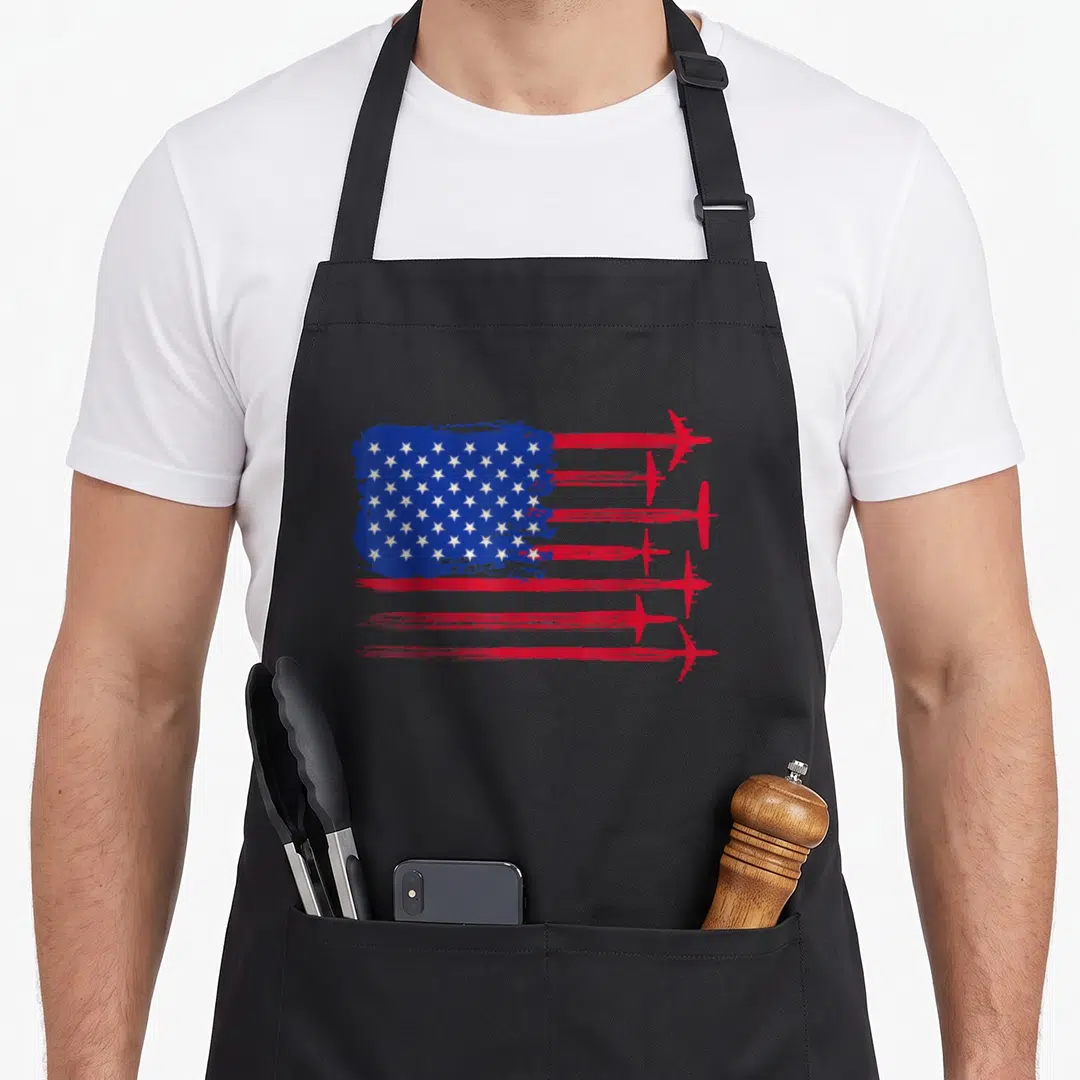 Aircraft chef and co aprons - Distressed USA flag with six red airplanes forming stripes in blue and white — shown on a black cotton canvas apron against a white background