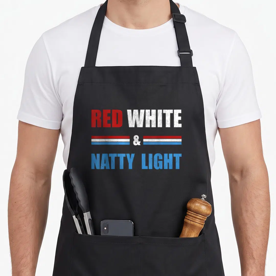 Natty beer apron - Distressed red white and blue text reading Red White & Natty Light with horizontal stripes — shown on a black cotton canvas apron against a white background