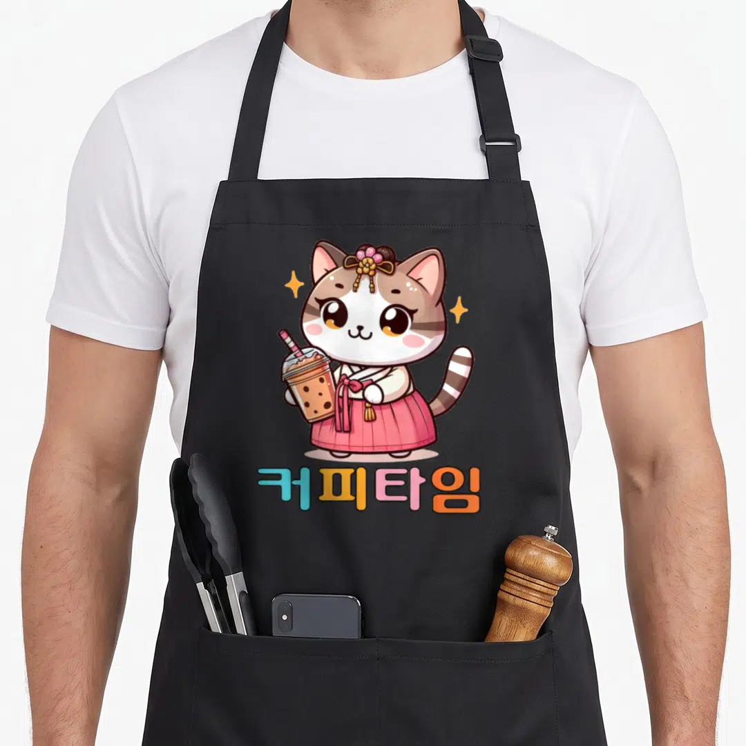 Coffee korean hanbok apron - Cartoon cat in pink hanbok holding bubble tea with colorful Korean text below — shown on a black cotton canvas apron against a white background