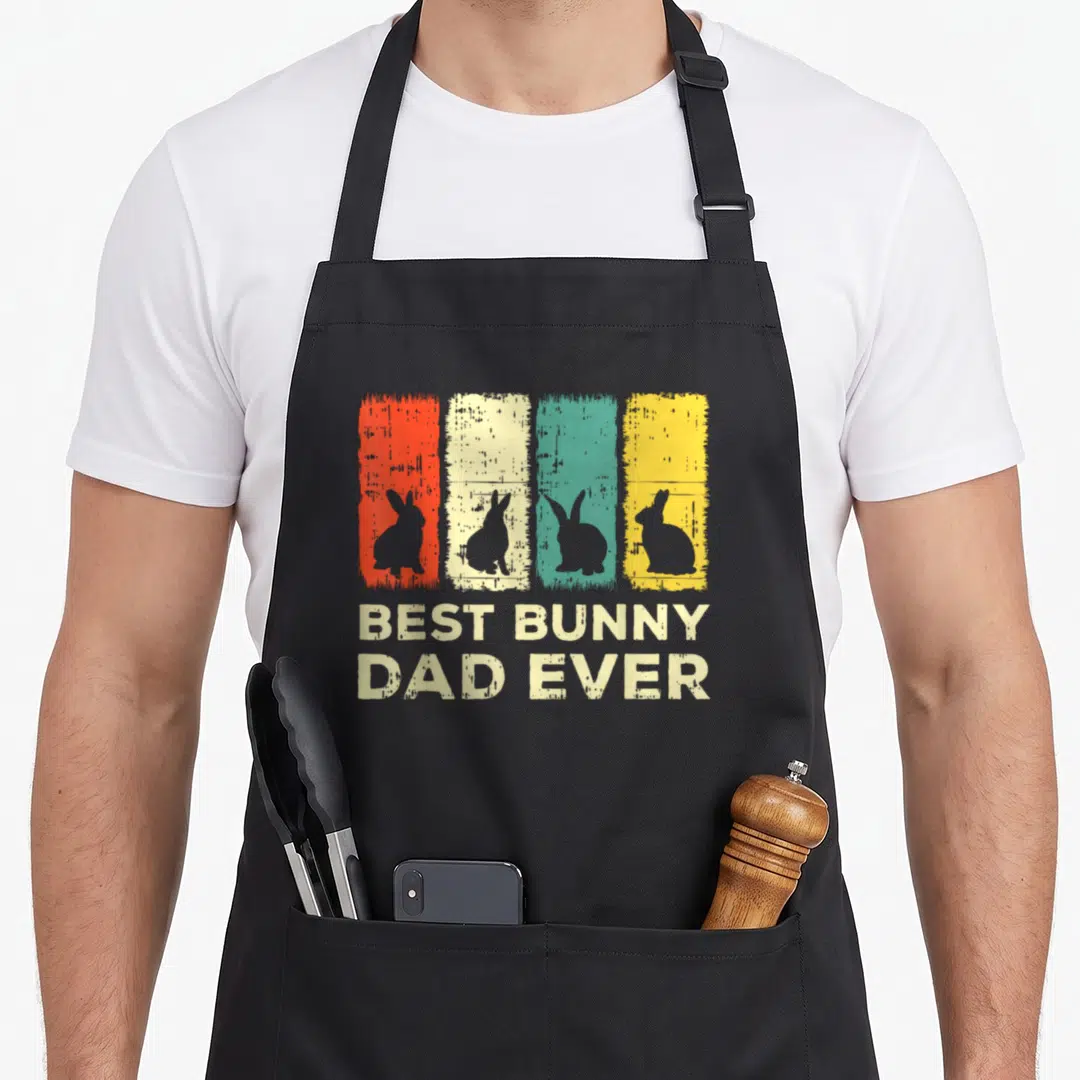 Rabbit animal bunny apron - Four colored stripes with grey bunny silhouettes above BEST BUNNY DAD EVER text — shown on a black cotton canvas apron against a white background