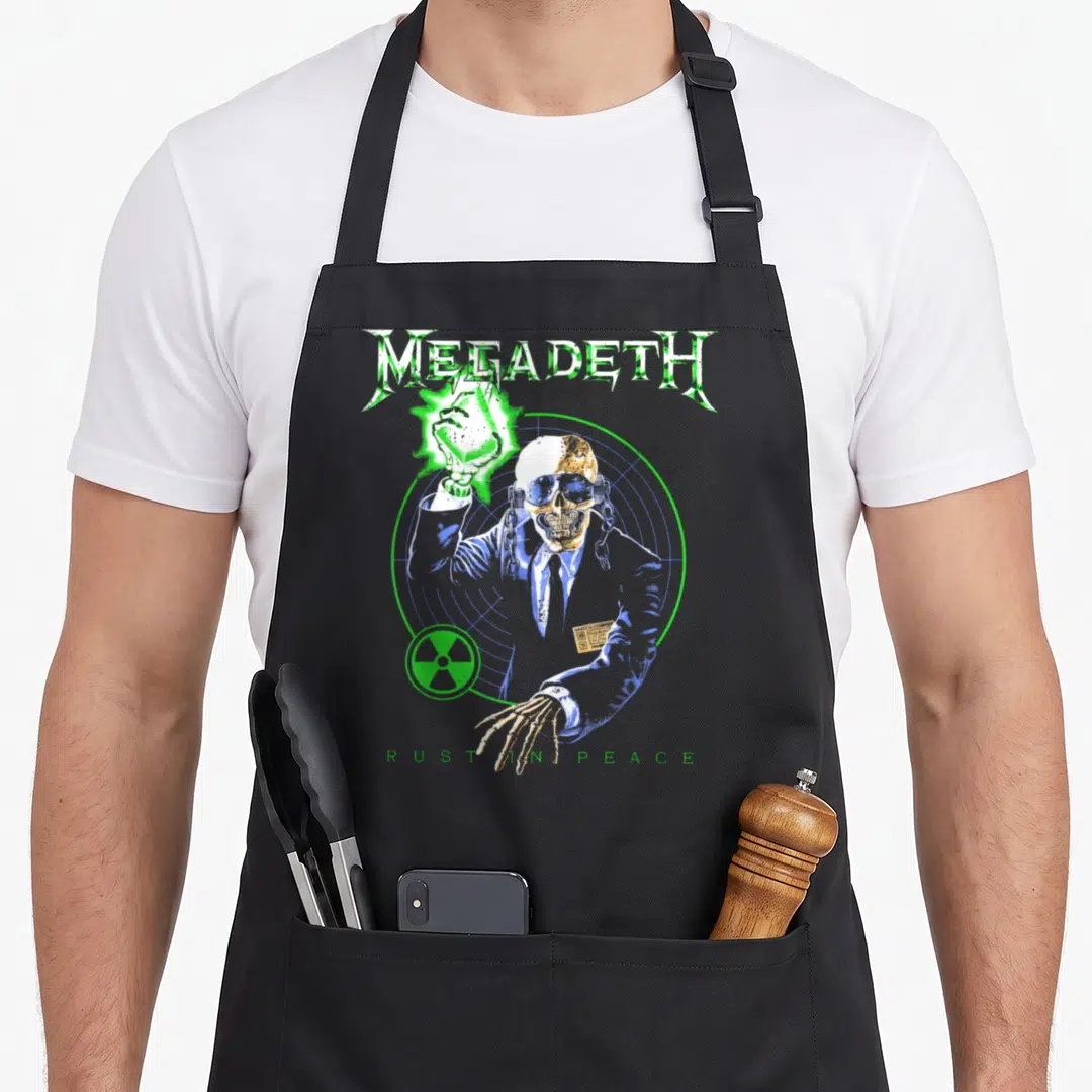 Rust heavy metal apron - Skeleton in suit inside radar target with MEGADETH text and radiation symbol — shown on a black cotton canvas apron against a white background