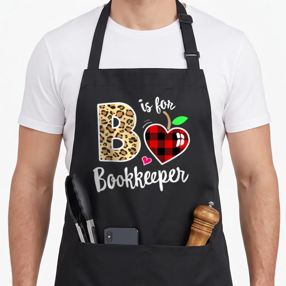 Admin bookkeeper apron - Leopard print letter B next to red black plaid apple heart with green leaf and white script — shown on a black cotton canvas apron against a white background