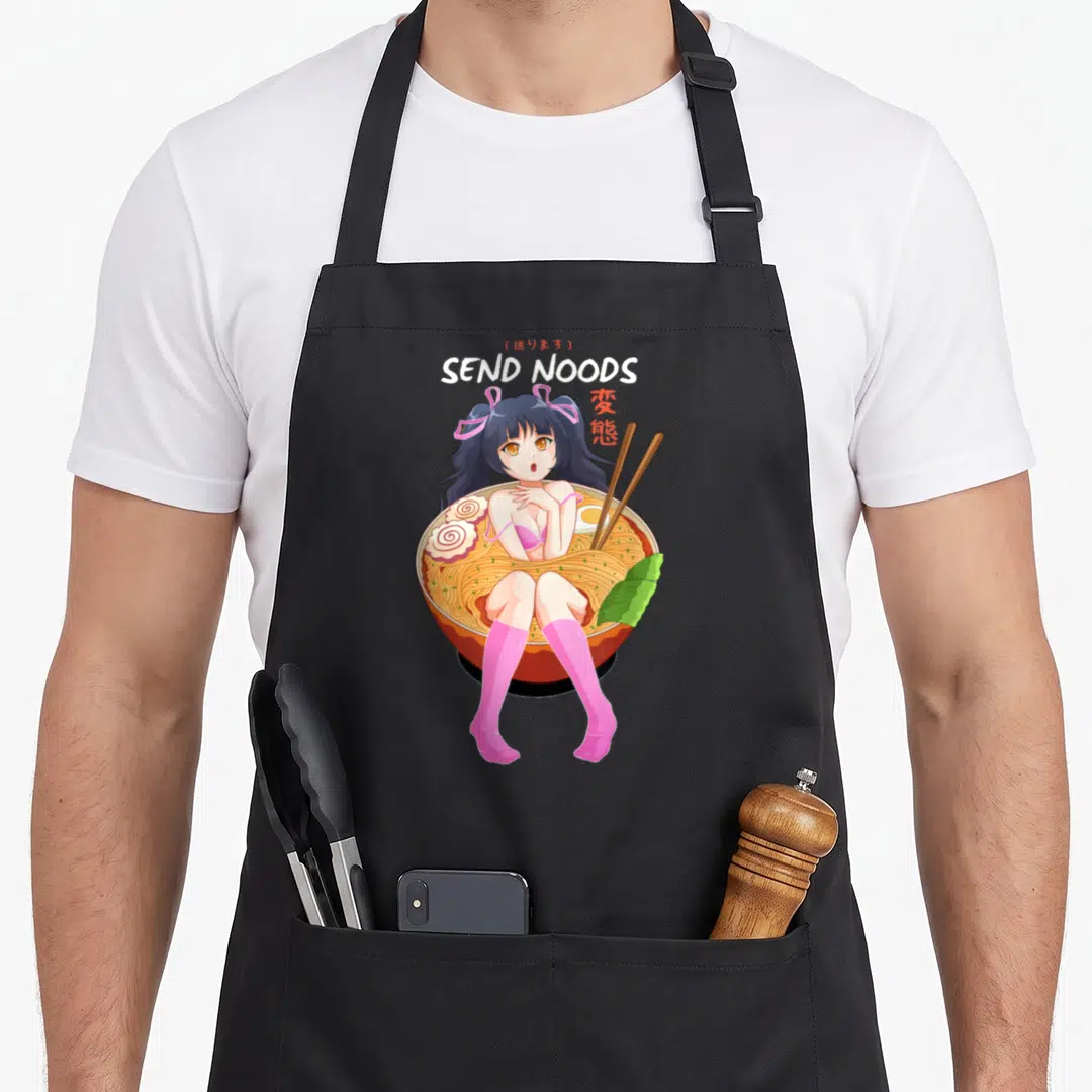 Noodle pasta apron - Anime girl in ramen bowl with SEND NOODS text and red kanji — shown on a black cotton canvas apron against a white background