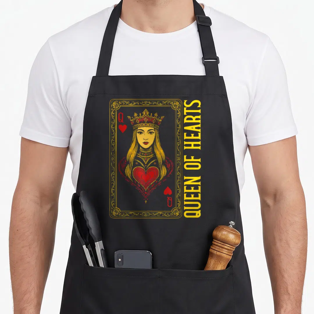 Card passion queen apron - Vintage Queen of Hearts playing card design in yellow and red with ornate frame — shown on a black cotton canvas apron against a white background