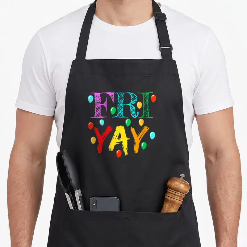 Friyay weekend friday teacher apron - FRI YAY text surrounded by purple blue green red yellow orange balloons — shown on a black cotton canvas apron against a white background