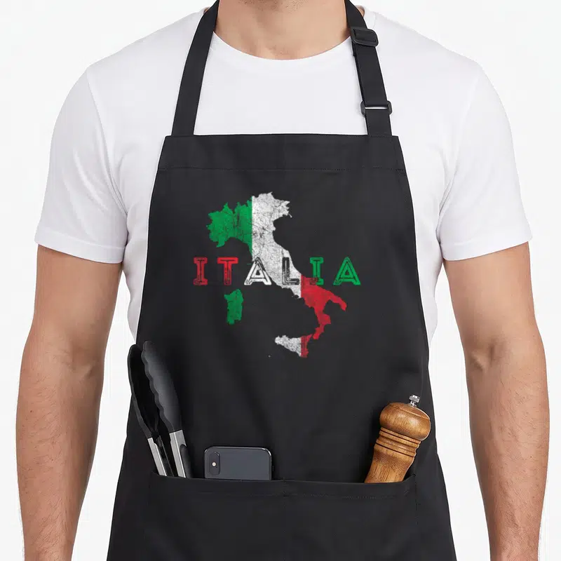 Map italy apron - Distressed Italia map print in green white and red flag colors — shown on a black cotton canvas apron against a white background