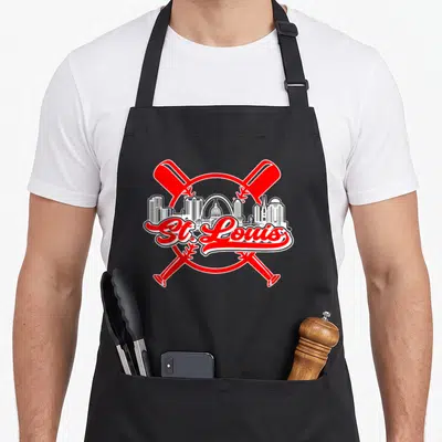 Funny louis baseball apron - Red crossed bats over white St. Louis skyline with red script text inside circular border — shown on a black cotton canvas apron against a white background
