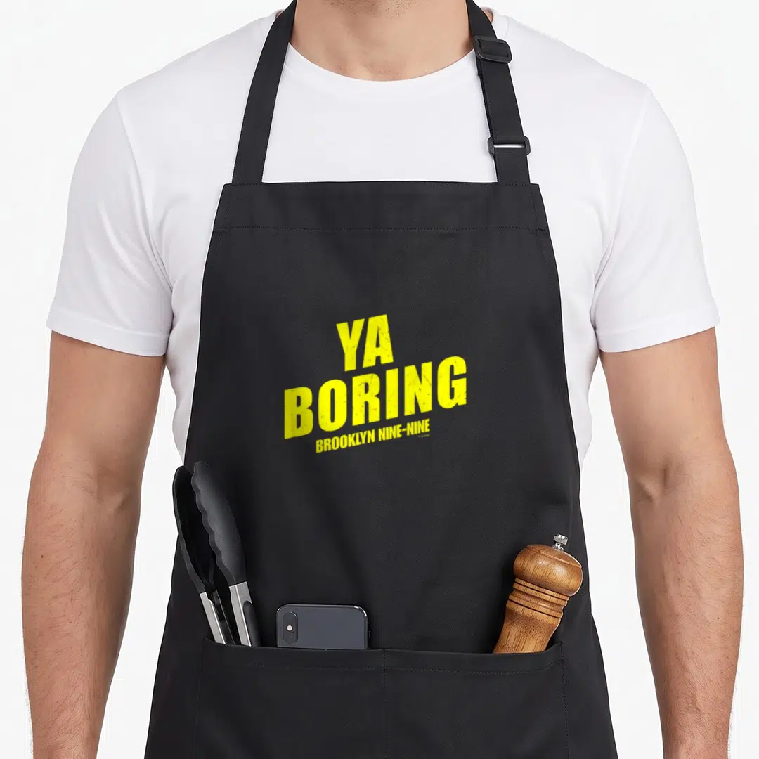 Boring brooklyn apron - Yellow stacked text reading YA BORING BROOKLYN NINE-NINE on black fabric — shown on a black cotton canvas apron against a white background