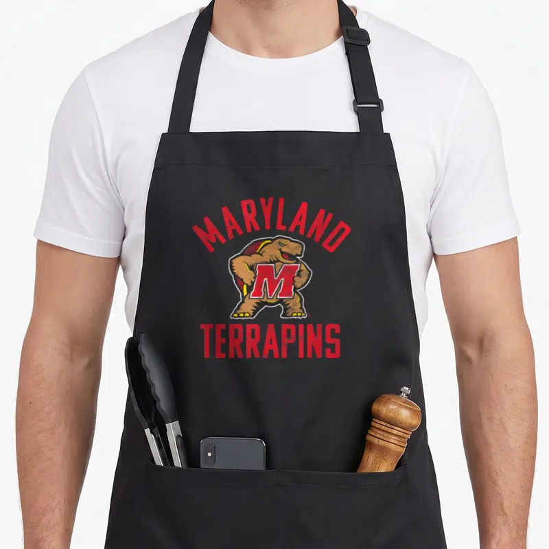 University maryland eastern apron - Cartoon terrapins turtle with red MARYLAND text arching over and TERRAPINS below — shown on a black cotton canvas apron against a white background