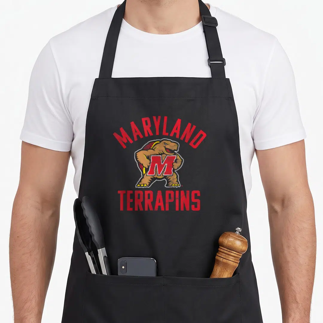 University maryland eastern apron - Cartoon terrapins turtle with red MARYLAND text arching over and TERRAPINS below — shown on a black cotton canvas apron against a white background