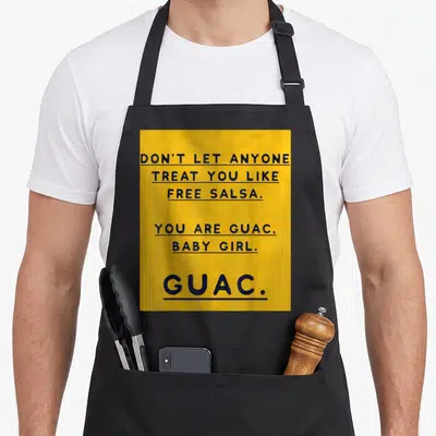 Anyone avocado lover apron - Dark blue text on yellow background reading Don't let anyone treat you like free salsa You — shown on a black cotton canvas apron against a white background