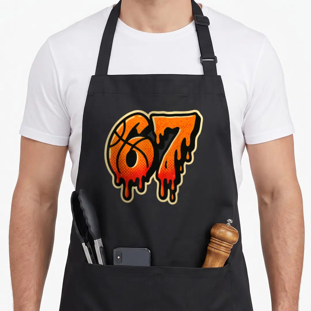Gen ice cream apron - Number 67 with basketball texture and melting orange drip art — shown on a black cotton canvas apron against a white background