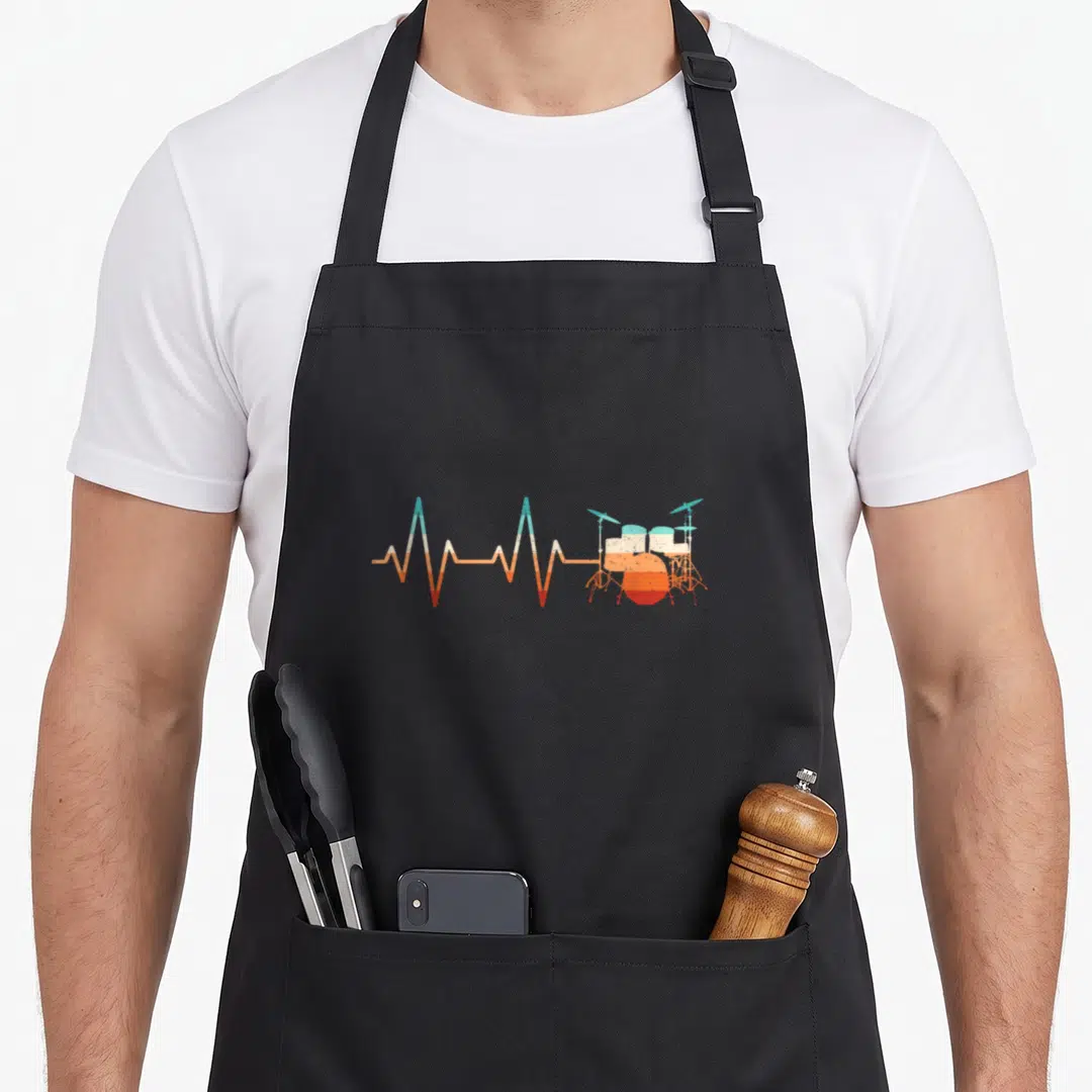 Heartbeat drumming drum apron - Minimalist EKG line transitioning to drum kit in teal white and orange — shown on a black cotton canvas apron against a white background