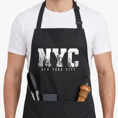 Nyc skyline new york apron - Large NYC letters filled with grayscale city skyline photo and NEW YORK CITY text below — shown on a black cotton canvas apron against a white background