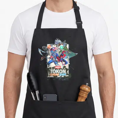 Tokon game aprons - Four superheroes and MARVEL TOKON FIGHTING SOULS text on blueprint background — shown on a black cotton canvas apron against a white background