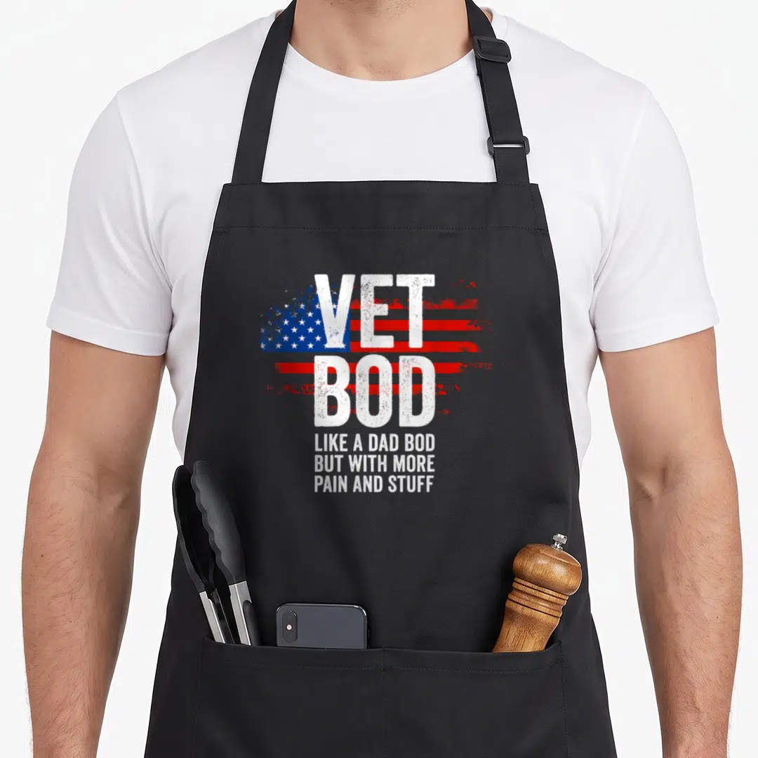 Veteran dad bod apron - Distressed USA flag with VET BOD and three lines of white text — shown on a black cotton canvas apron against a white background