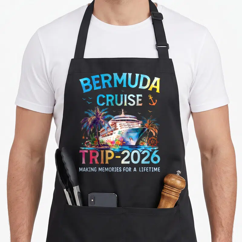 Cruise trip family aprons - Bermuda Cruise Trip 2026 watercolor ship palm trees anchor lifebuoy text — shown on a black cotton canvas apron against a white background