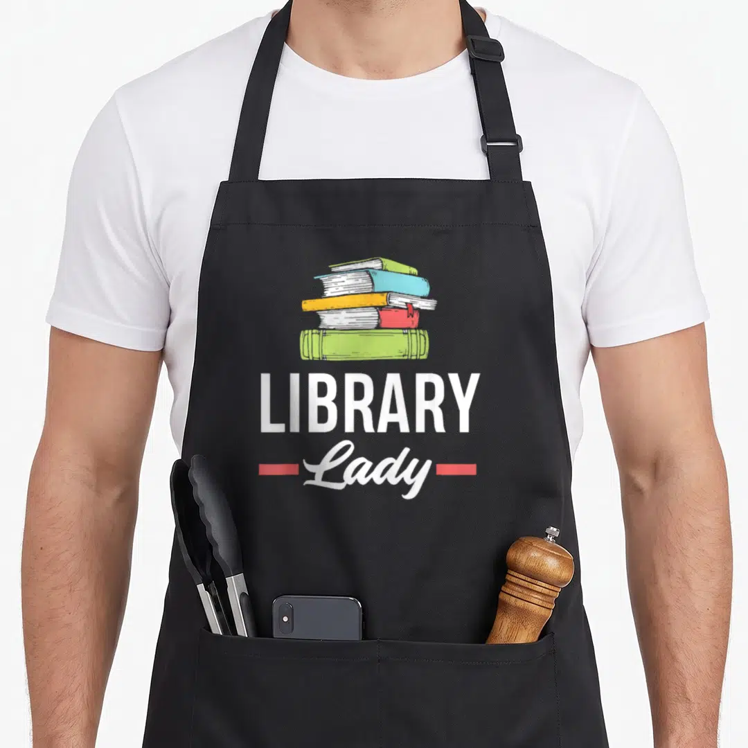 Librarian love library apron - Stack of five books above LIBRARY Lady text with red lines — shown on a black cotton canvas apron against a white background