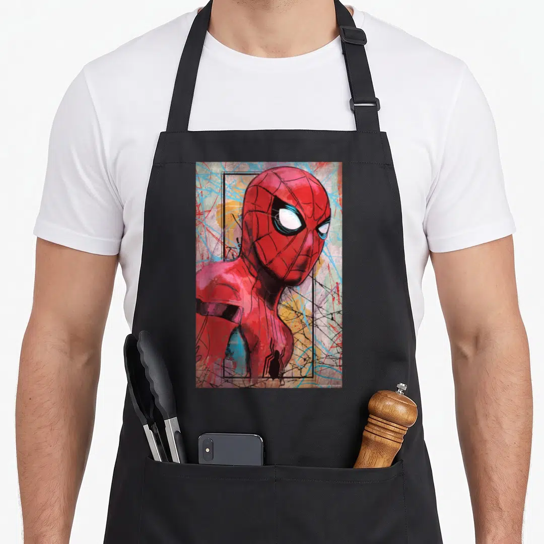 Poster novelty apron - Spider-Man in red and blue with black frame and colorful splatters — shown on a black cotton canvas apron against a white background