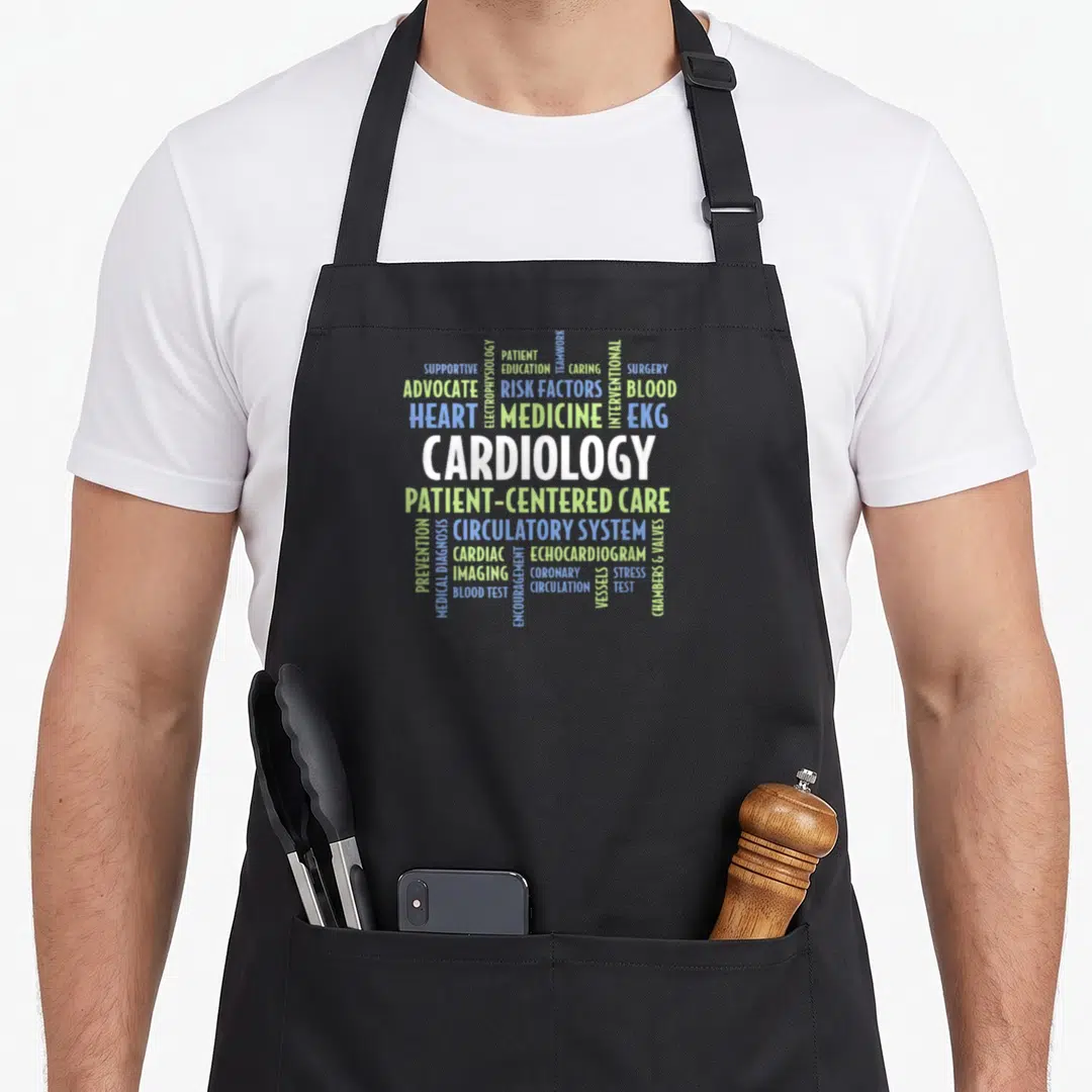Cardiologist professional aprons - Cardiology word cloud with medical terms like EKG, CHAMBERS & VALVES — shown on a black cotton canvas apron against a white background