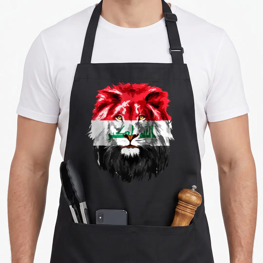 Iraqi face apron - Realistic lion head filled with red white black and green flag colors — shown on a black cotton canvas apron against a white background
