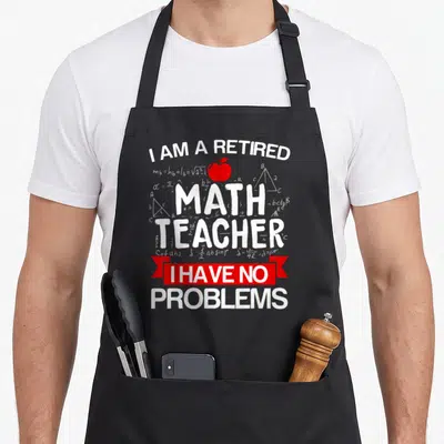 Problem mathematician teacher apron - Stacked white text reading retired math teacher with red ribbon and apple — shown on a black cotton canvas apron against a white background