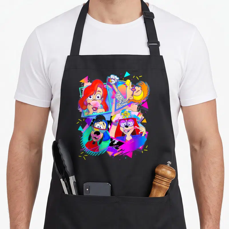 Movie bubble apron - Four cartoon characters in pink blue yellow red geometric cluster — shown on a black cotton canvas apron against a white background
