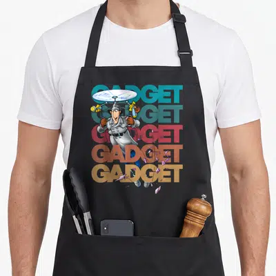 Inspector gadget apron - Cartoon spy with helicopter hat over five stacked GADGET words in teal red brown tan grey — shown on a black cotton canvas apron against a white background