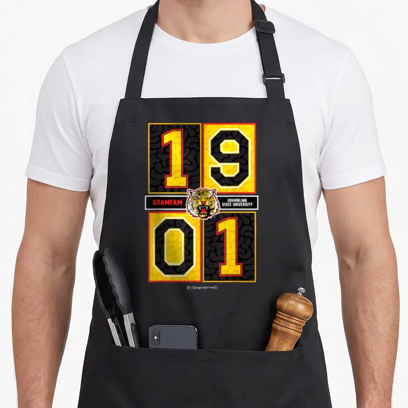 Grambling dungeon forward apron - Tiger head between 1901 numbers with Gramblinger State University text bars — shown on a black cotton canvas apron against a white background