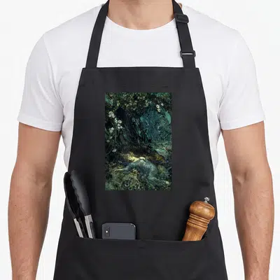 Fairy cottagecore apron - Woman in blue dress lying in dark forest with white flowers, realistic art style — shown on a black cotton canvas apron against a white background