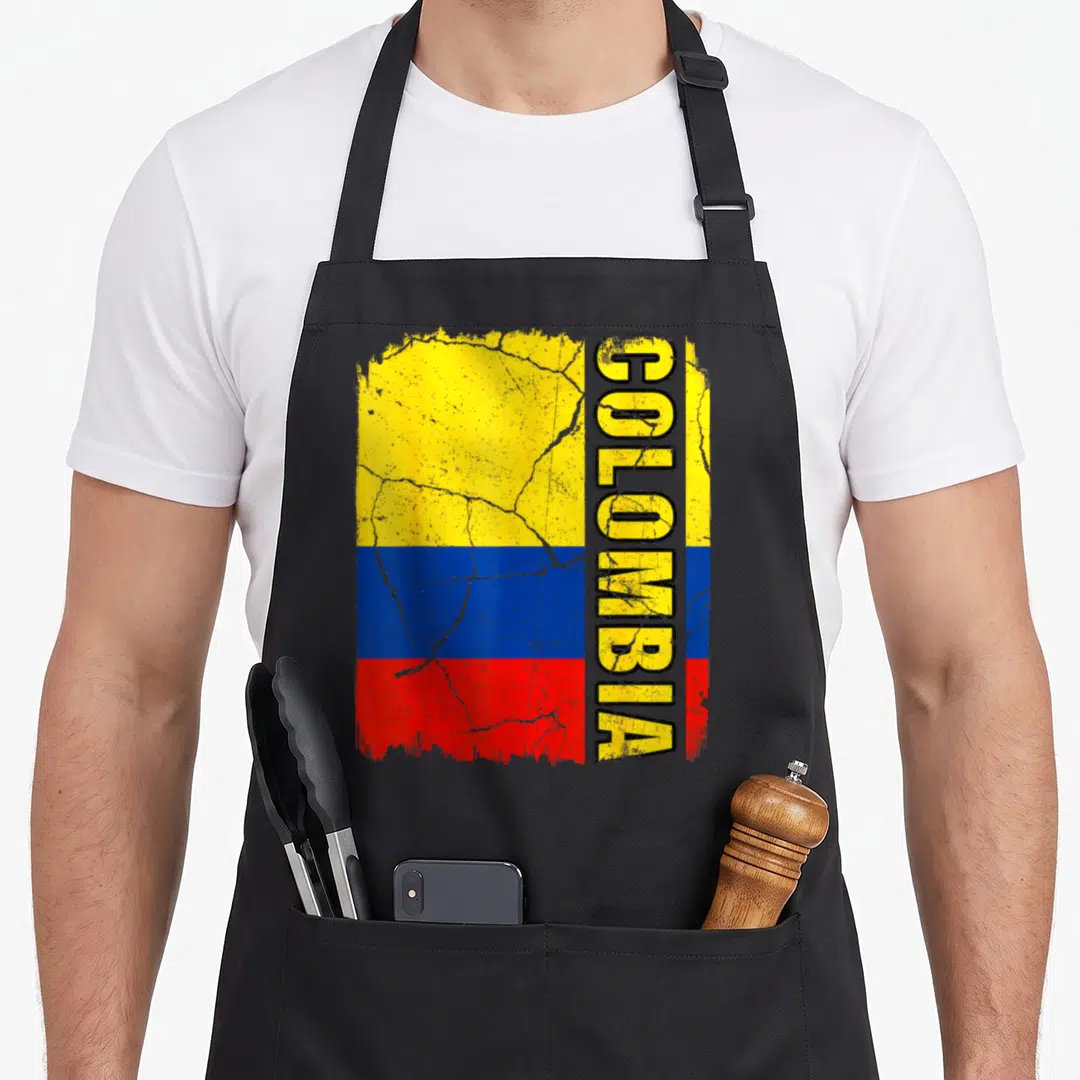 Colombian flag pride apron - Distressed Colombian flag stripes with vertical COLOMBIA text overlay — shown on a black cotton canvas apron against a white background