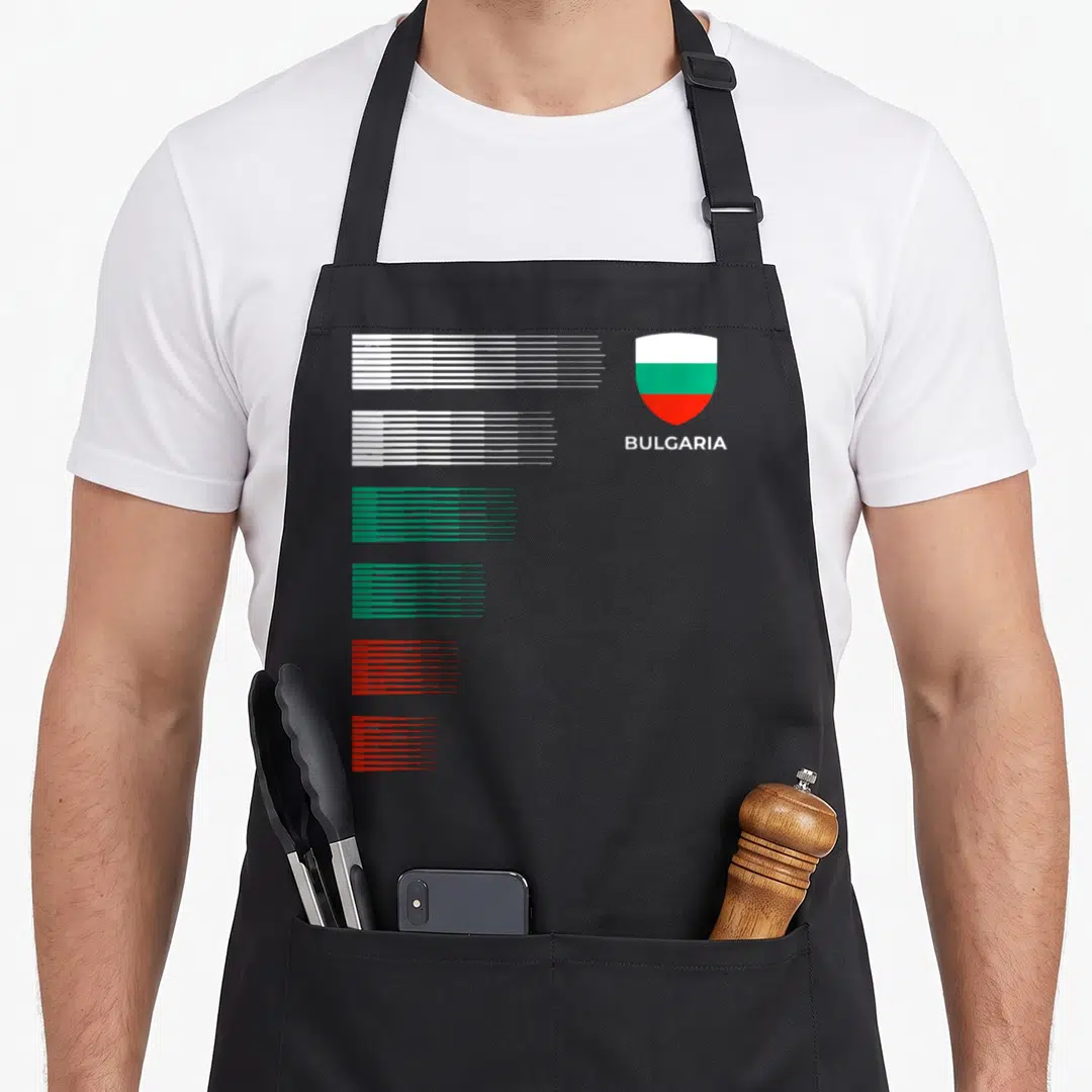 Bulgaria patriotic apron - Shield with Bulgarian flag and BULGARIA text next to six groups of white green and red speed — shown on a black cotton canvas apron against a white background