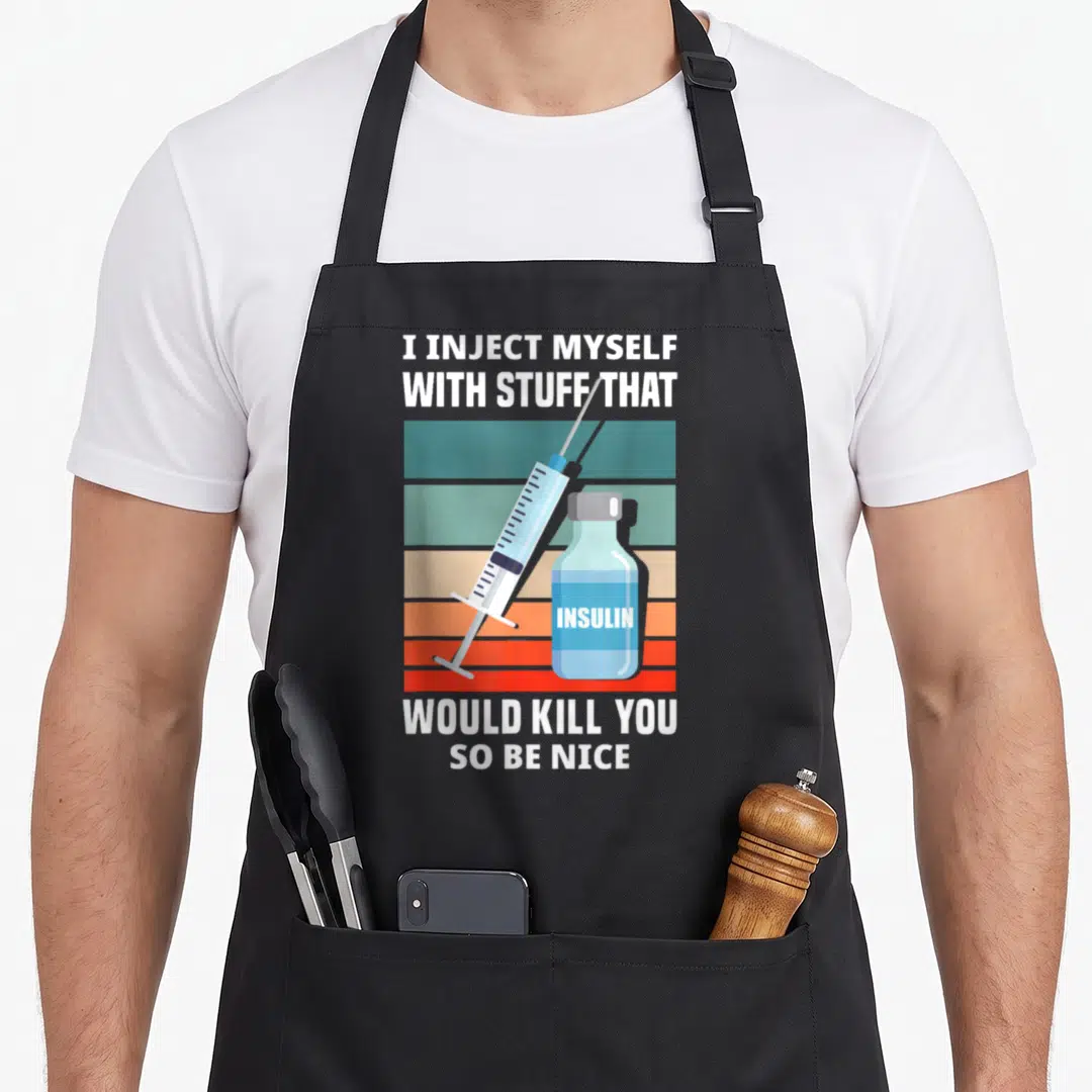 Diabetic novelty apron - Syringe and insulin vial over teal orange red stripes with white text — shown on a black cotton canvas apron against a white background
