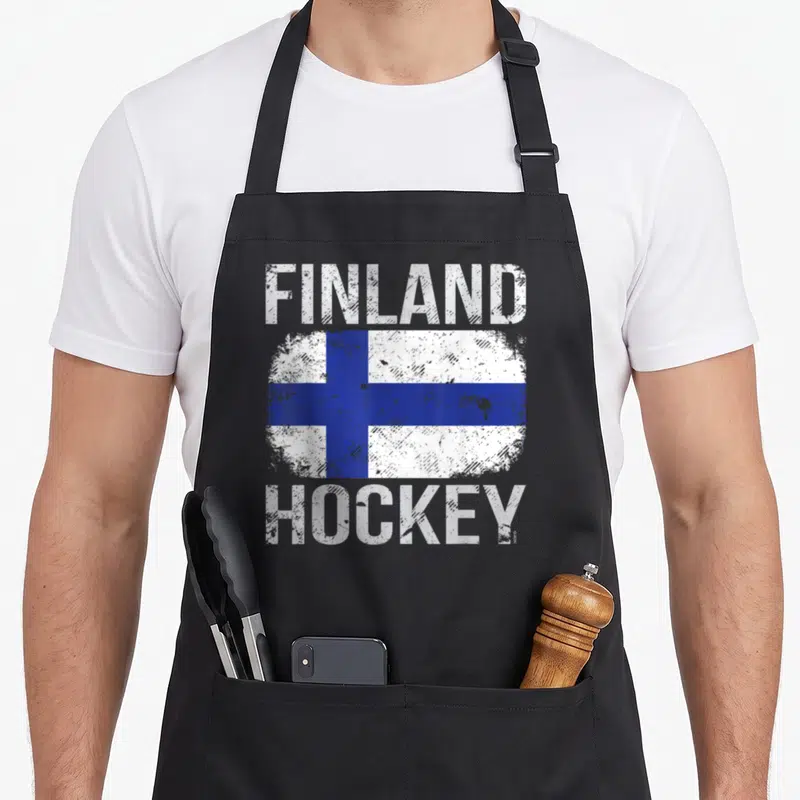 Finland nofo co apron - Distressed white and blue Finnish flag with Finland Hockey text — shown on a black cotton canvas apron against a white background