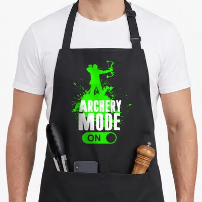 Mode bow apron - Green archer silhouette, white ARCHERY MODE ON text, green toggle switch — shown on a black cotton canvas apron against a white background