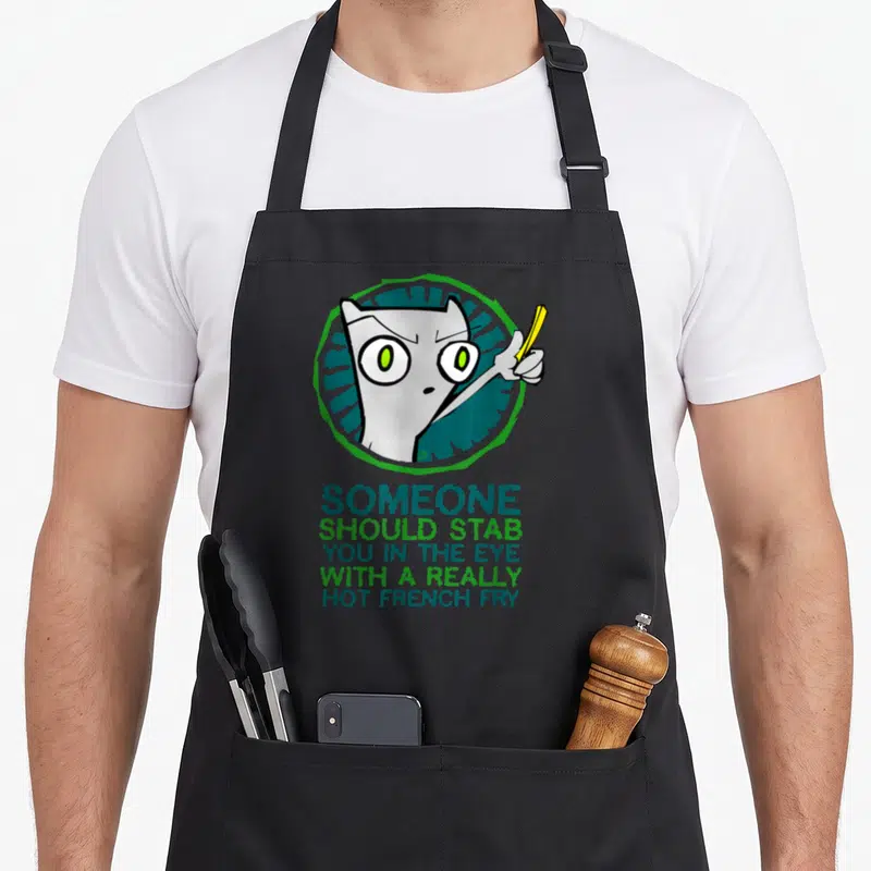 Fry classic french apron - Cartoon grey cat head in blue circle holding yellow fry with sarcastic text below — shown on a black cotton canvas apron against a white background