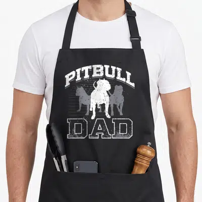 Owner father day apron - White pitbull silhouette with arched PITBULL and straight DAD text on grey stripes — shown on a black cotton canvas apron against a white background